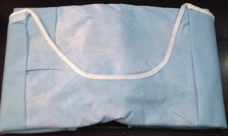 Surgical gown with white neckhole